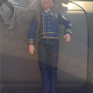 Blue and Gold Toy Doll